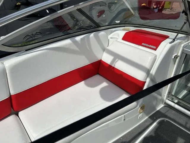 Slide: The Image of 2008 BRP Sea Doo WAKE 230 Jetboat interior with red and white seating. - 6