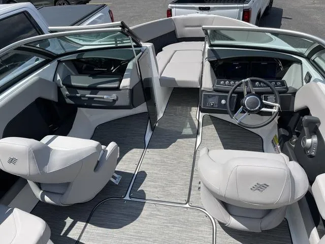 Slide: The Image of 2023 Four Winns H4 boat interior with modern dashboard and seating. - 5