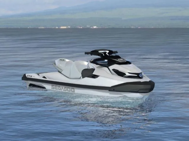 Slide: The Image of 2024 BRP Sea-Doo GTX LTD 300 Waverunner in white pearl on calm water. - 1