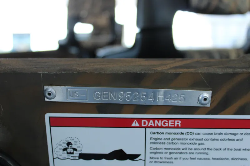 Slide: The Image of 2025 G3 Gator Tough 15 DK boat with identification plate and carbon monoxide warning label. - 14
