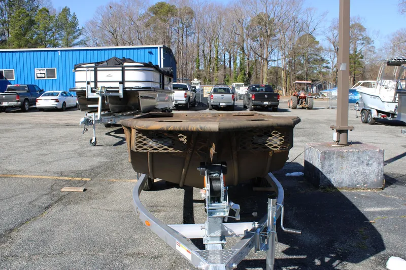 Slide: The Image of 2025 G3 Gator Tough 15 DK boat with Yamaha motor in showroom. - 2