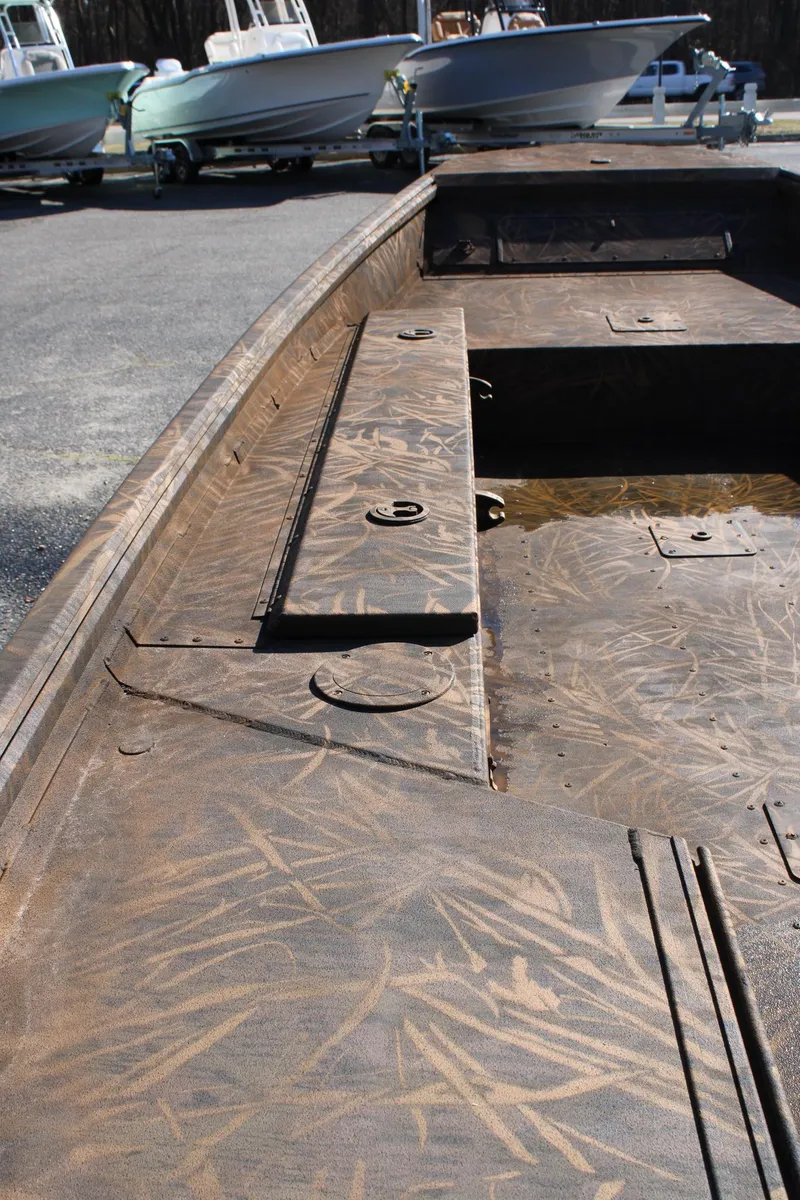 Slide: The Image of 2025 G3 Gator Tough 15 DK boat on display in showroom with Yamaha motor. - 5