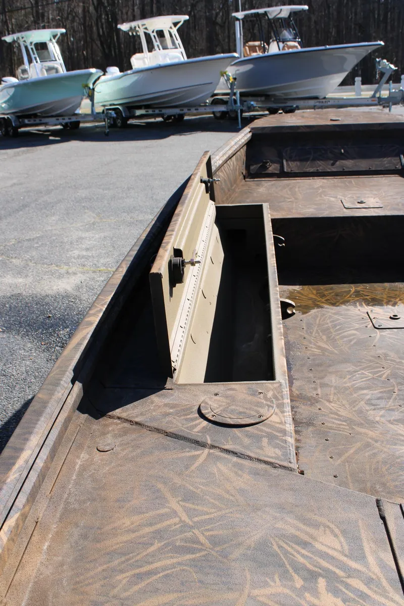 Slide: The Image of 2025 G3 Gator Tough 15 DK boat on trailer in showroom. - 6