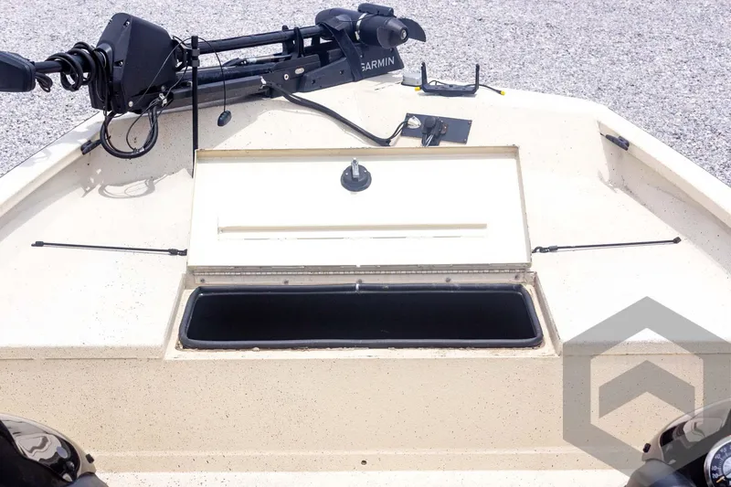 Slide: The Image of 2008 Xpress HD18SCA boat deck with open storage compartment and Garmin equipment. - 12