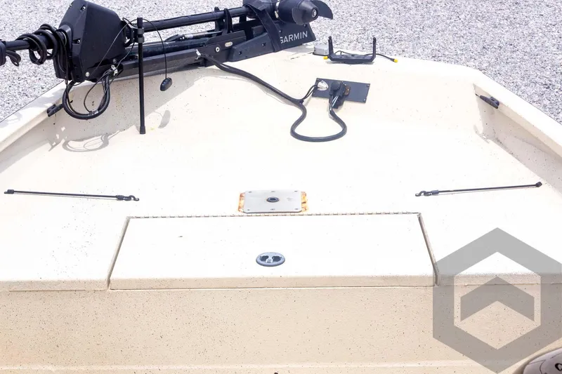 Slide: The Image of 2008 Xpress HD18SCA boat deck with Garmin equipment and storage compartment. - 13