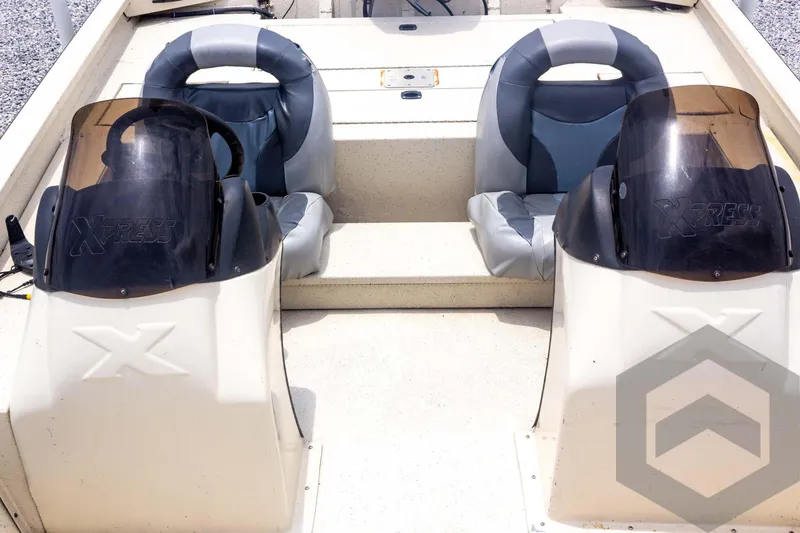 Slide: The Image of 2008 Xpress HD18SCA boat interior with dual seats and steering consoles. - 15