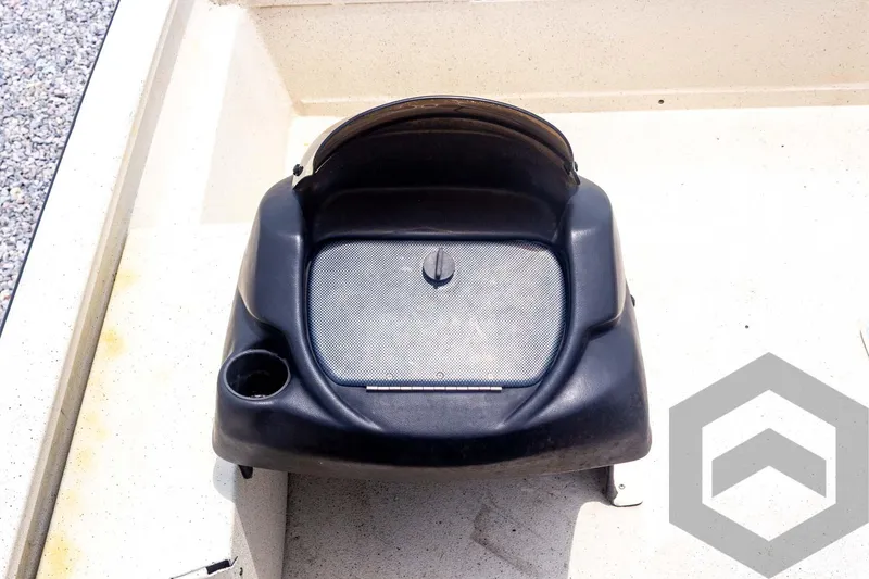 Slide: The Image of 2008 Xpress HD18SCA boat console with cup holder and storage compartment. - 19