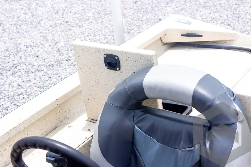 Slide: The Image of 2008 Xpress HD18SCA boat interior with steering wheel and seating. - 27