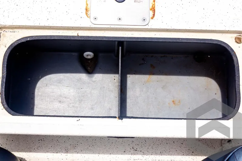 Slide: The Image of Open storage compartment in 2008 Xpress HD18SCA boat. - 28
