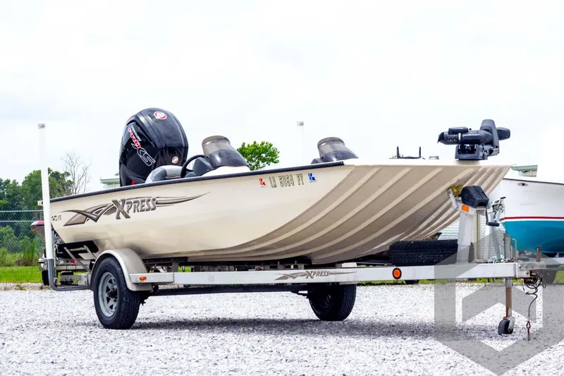 Slide: The Image of 2008 Xpress HD18SCA boat on trailer, featuring outboard motor and sleek design. - 3