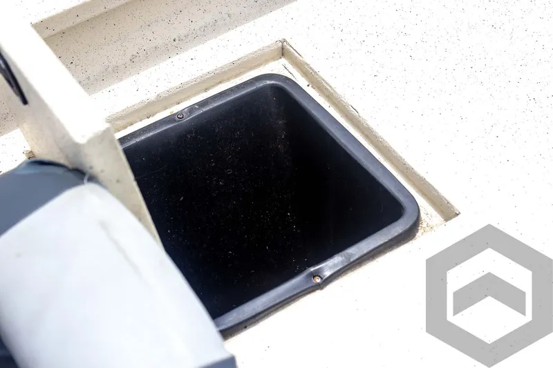 Slide: The Image of Open storage compartment on 2008 Xpress HD18SCA boat deck. - 30