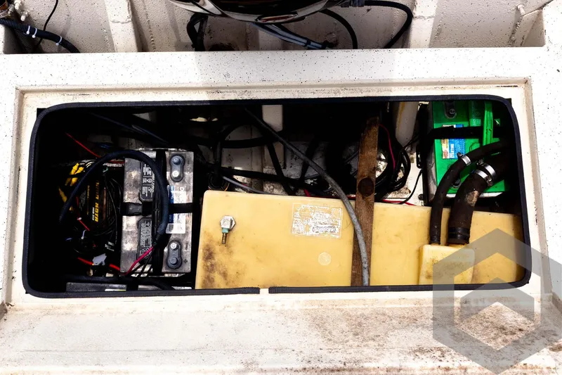Slide: The Image of Battery compartment of 2008 Xpress HD18SCA boat with wiring and components. - 31