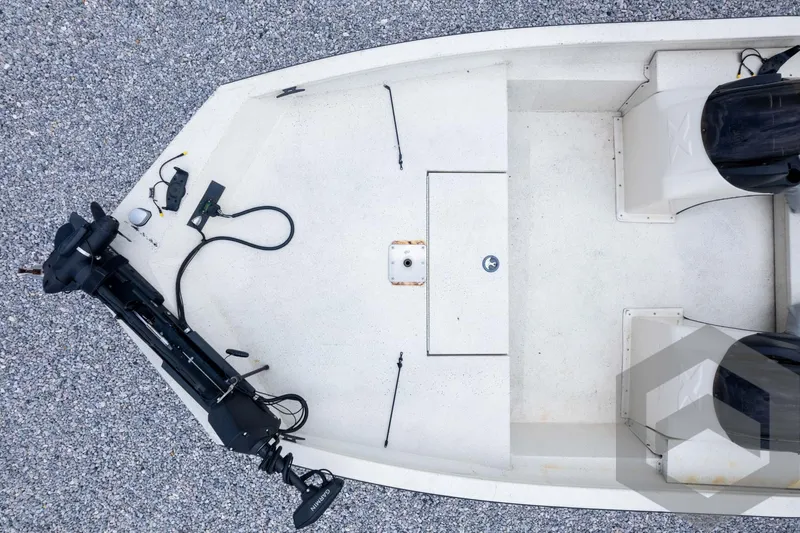 Slide: The Image of 2008 Xpress HD18SCA boat interior with motor, seats, and storage compartments. - 33