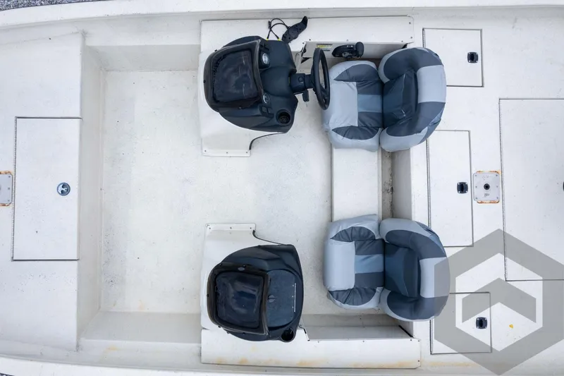 Slide: The Image of 2008 Xpress HD18SCA boat interior with dual seats and steering console, top view. - 34