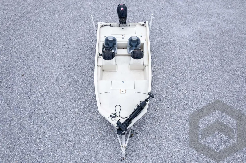 Slide: The Image of 2008 Xpress HD18SCA boat, aerial view, two seats, motor, gravel background. - 37