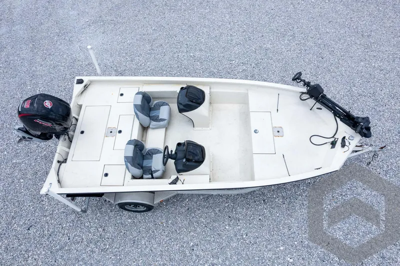 Slide: The Image of 2008 Xpress HD18SCA boat, aerial view, featuring dual seats and motor on gravel surface. - 39