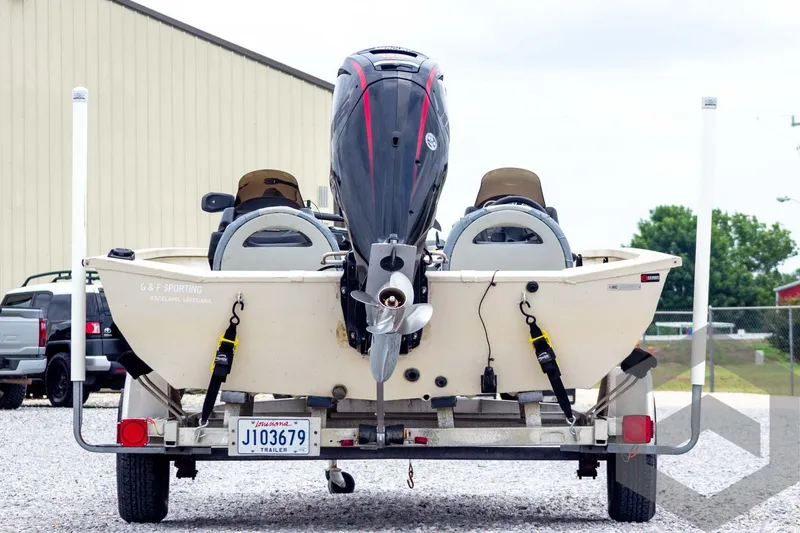 Slide: The Image of 2008 Xpress HD18SCA boat on trailer with outboard motor, rear view. - 5