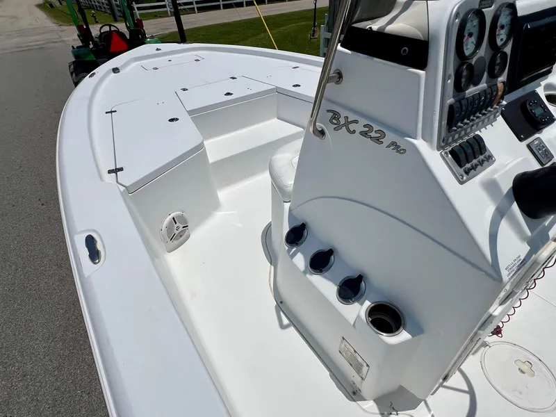 Slide: The Image of 2010 Sea Hunt BX22 Pro boat interior with console and seating. - 12