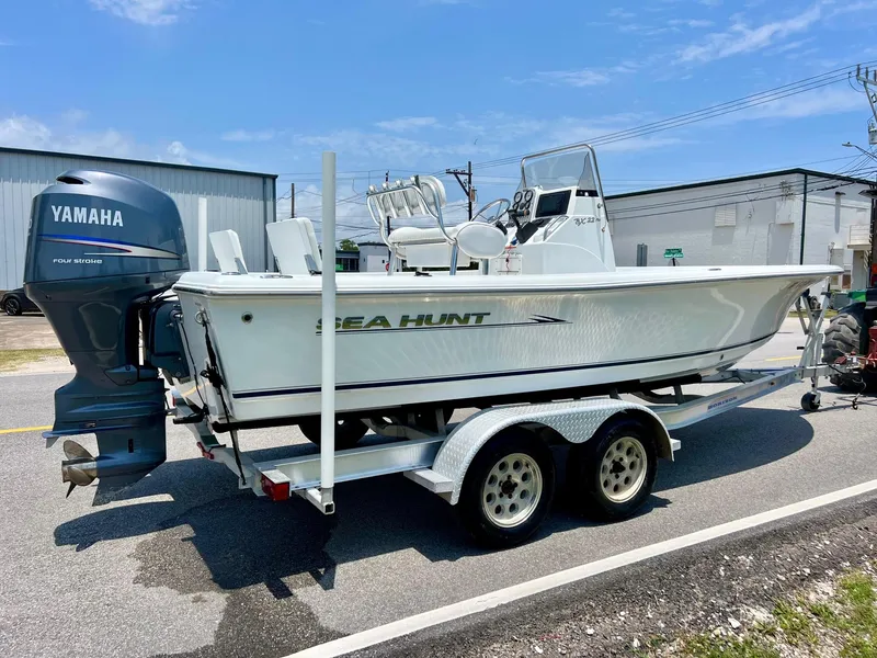 Slide: The Image of 2010 Sea Hunt BX22 Pro boat on trailer with Yamaha outboard motor. - 4