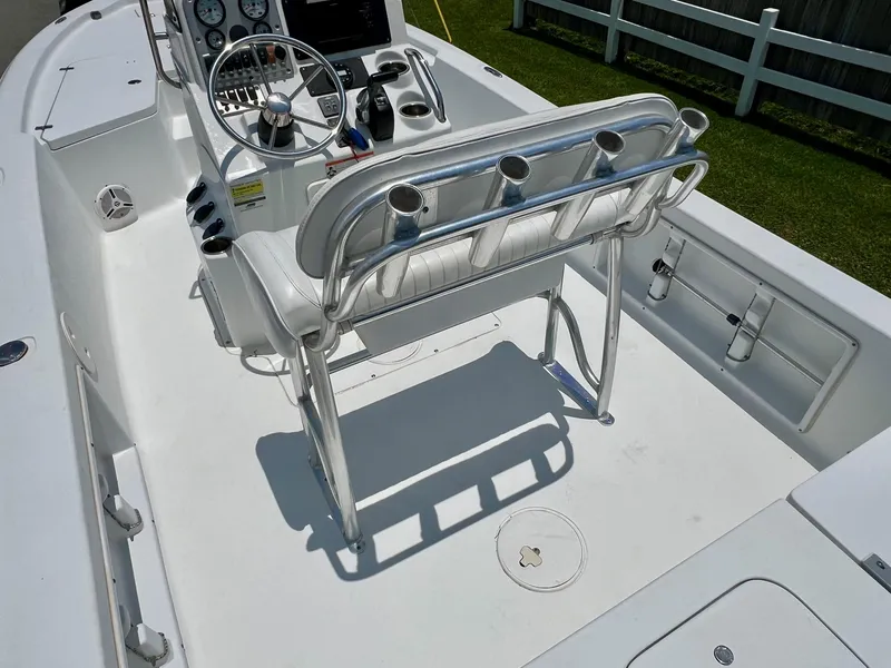 Slide: The Image of 2010 Sea Hunt BX22 Pro boat interior with steering console and seating. - 9