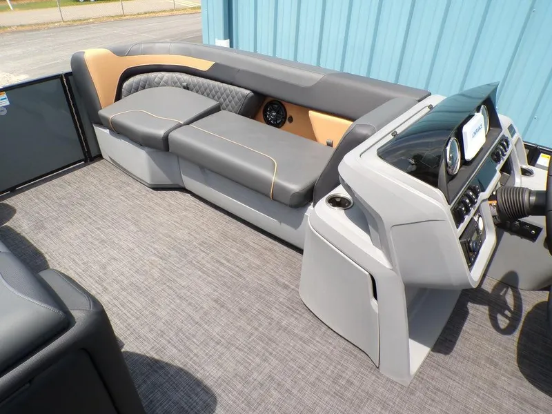 Slide: The Image of 2025 Godfrey Sweetwater 2286 SFL boat interior with modern seating and control console. - 12