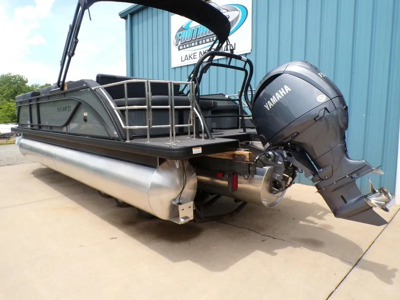 Slide: The Image of 2025 Godfrey Sweetwater 2286 SFL pontoon boat with Yamaha outboard motor, docked at marina. - 4