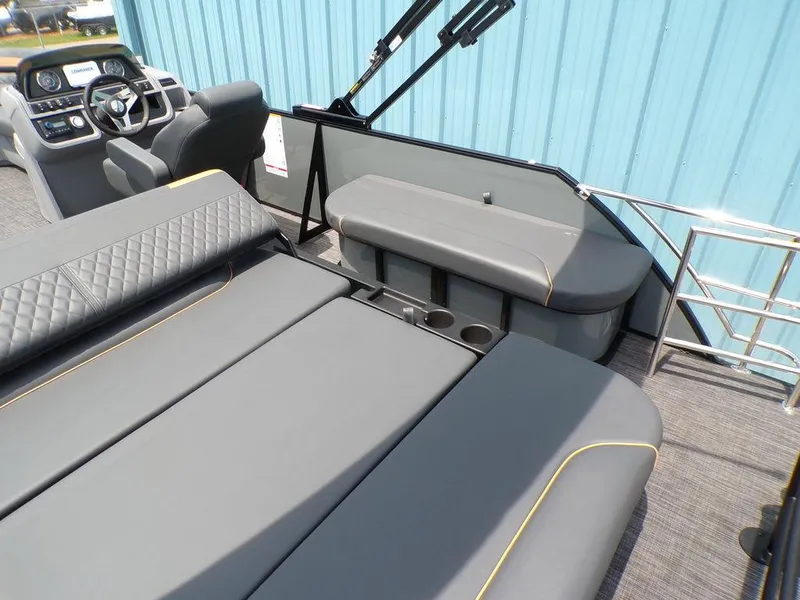 Slide: The Image of 2025 Godfrey Sweetwater 2286 SFL boat interior with gray seating and modern dashboard. - 6