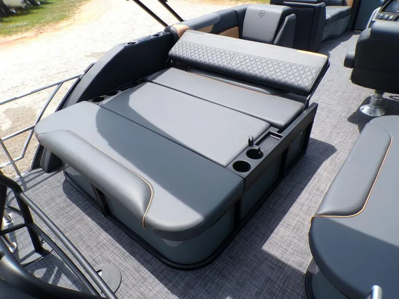 Slide: The Image of 2025 Godfrey Sweetwater 2286 SFL boat interior with luxurious seating and cup holders. - 7