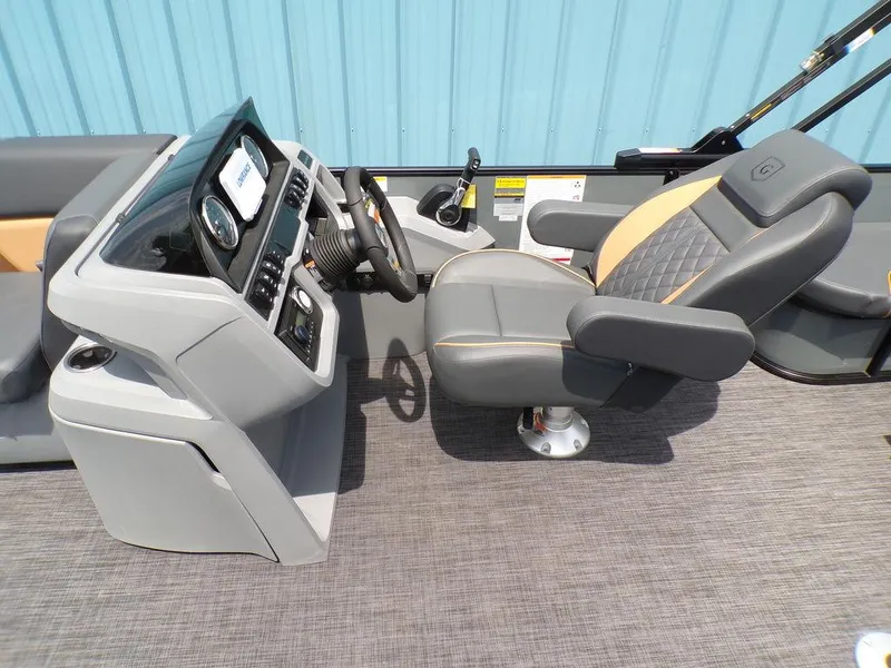 Slide: The Image of Captain's seat and console of 2025 Godfrey Sweetwater 2286 SFL pontoon boat. - 9