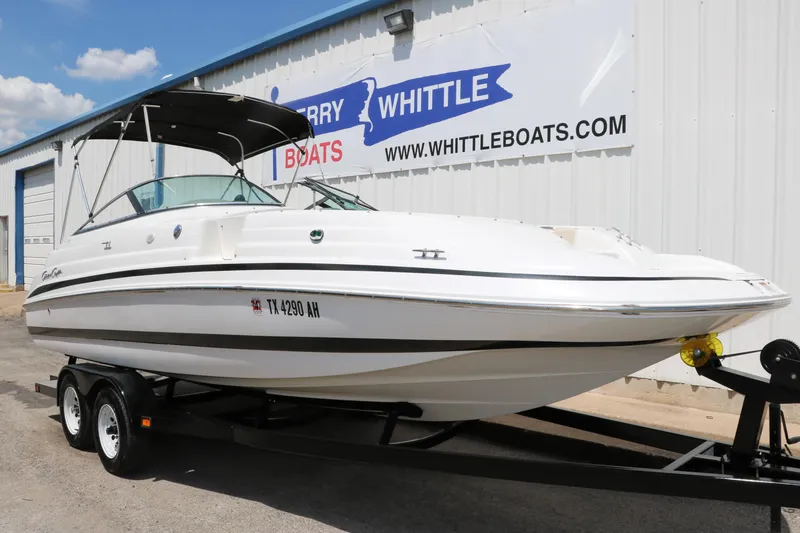 Slide: The Image of 2000 Chris-Craft 232 boat on trailer outside Whittle Boats dealership. - 15