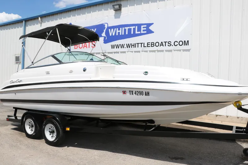 Slide: The Image of 2000 Chris-Craft 232 boat on trailer at Whittle Boats dealership. - 16