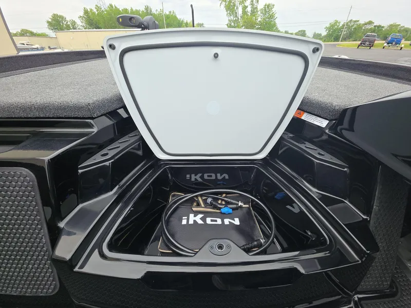 Slide: The Image of Open storage compartment of 2025 iKon vls20 boat, showcasing interior design and branding. - 17