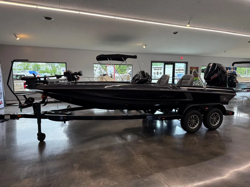 Slide: The Image of 2025 iKon vls20 boat on trailer in showroom, sleek design, modern features. - 6