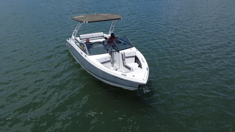 Slide: The Image of 2023 Cobalt R6 boat cruising on open water, featuring sleek design and spacious seating. - 17