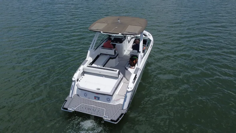 Slide: The Image of 2023 Cobalt R6 boat cruising on open water, rear view. - 18