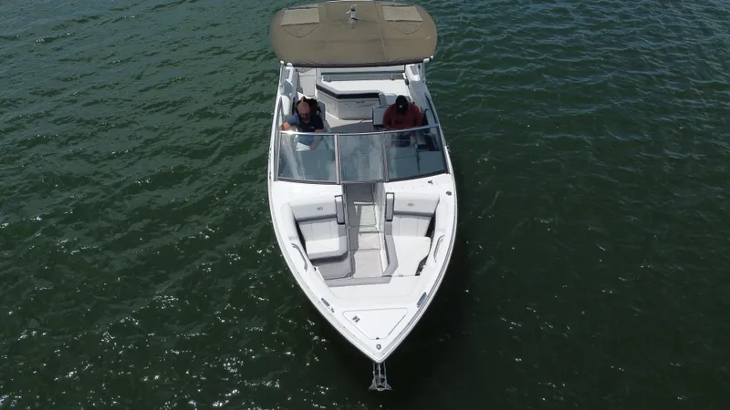 Slide: The Image of 2023 Cobalt R6 boat cruising on open water, aerial view. - 19