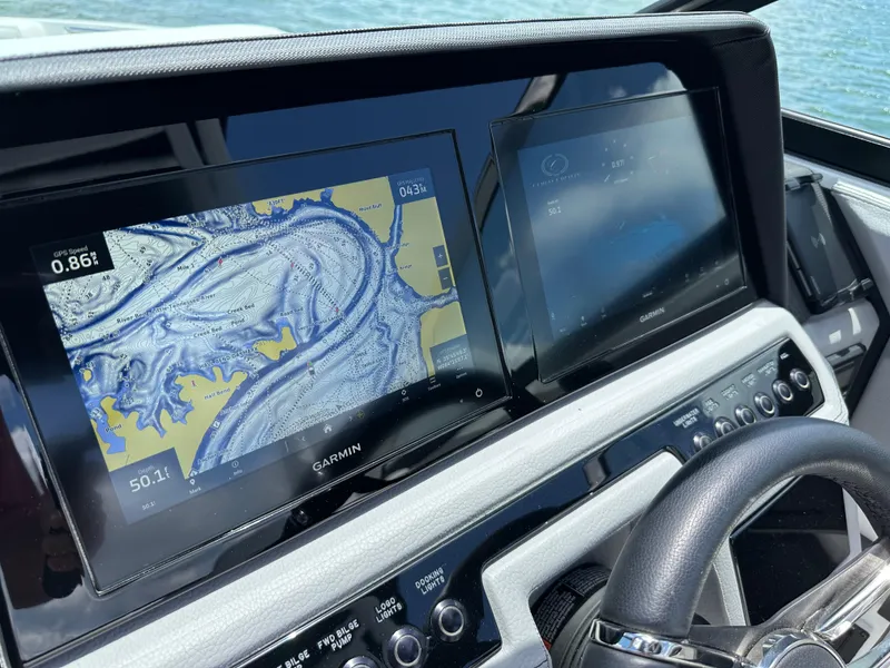 Slide: The Image of 2023 Cobalt R6 dashboard with Garmin navigation screens and steering wheel. - 21