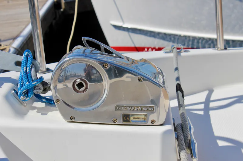 Slide: The Image of Chrome winch on 2011 Ranger Tugs R-27 boat deck with blue rope. - 11
