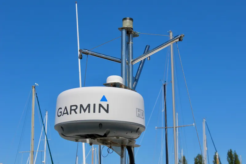 Slide: The Image of Garmin radar on 2011 Ranger Tugs R-27 boat against clear blue sky. - 12