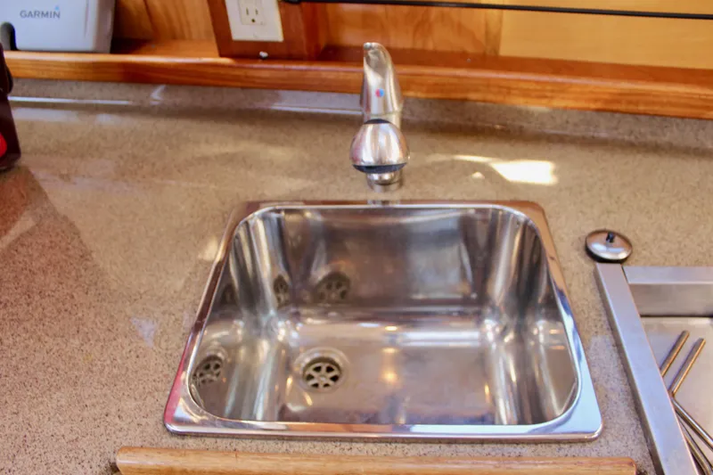 Slide: The Image of Stainless steel sink in 2011 Ranger Tugs R-27 boat galley. - 25