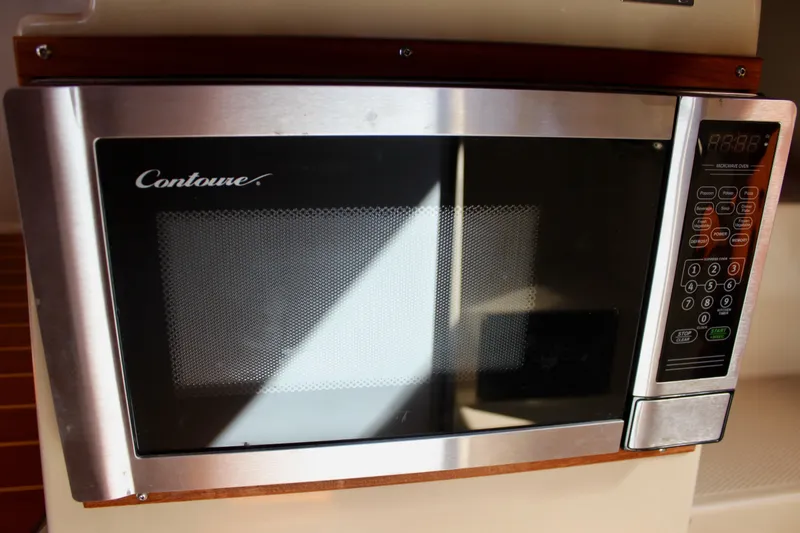 Slide: The Image of Microwave oven inside 2011 Ranger Tugs R-27 boat kitchen area. - 27
