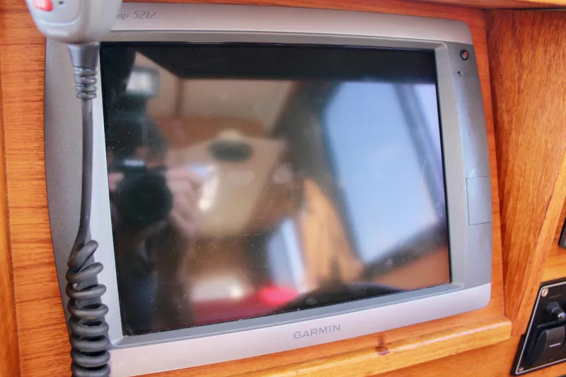 Slide: The Image of Garmin GPS device on 2011 Ranger Tugs R-27 boat dashboard. - 33