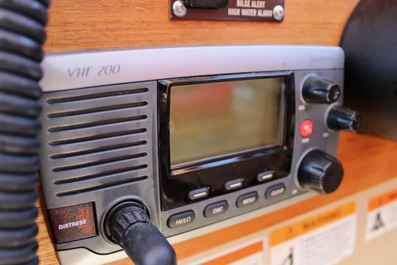 Slide: The Image of VHF 200 radio on 2011 Ranger Tugs R-27 boat dashboard. - 35