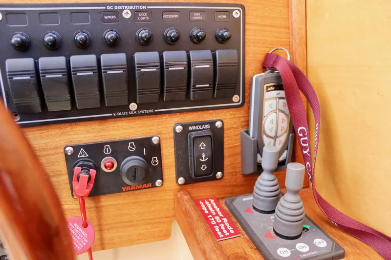 Slide: The Image of Control panel of a 2011 Ranger Tugs R-27 boat with switches and joysticks. - 37