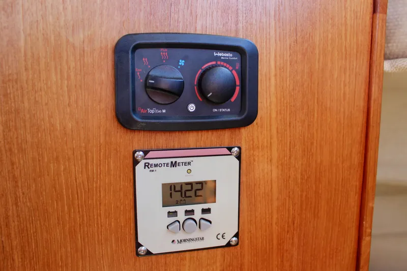 Slide: The Image of Control panel and remote meter on 2011 Ranger Tugs R-27 boat interior. - 39