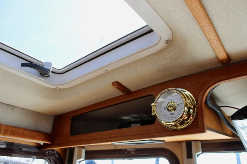 Slide: The Image of Interior of 2011 Ranger Tugs R-27 boat with skylight and barometer. - 42