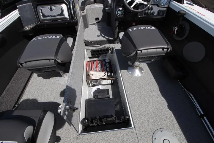 Slide: The Image of Interior of 2025 Lund 1975 Tyee boat with storage compartment open. - 6