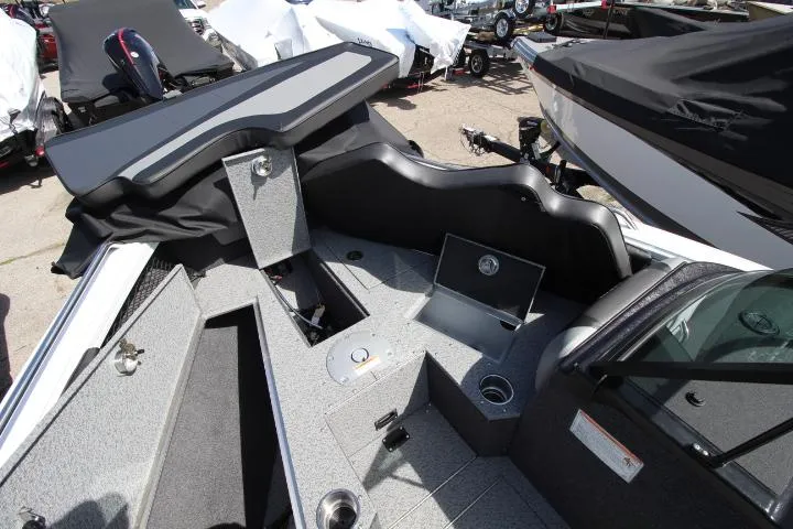 Slide: The Image of 2025 Lund 1975 Tyee boat interior with storage compartments and seating. - 7