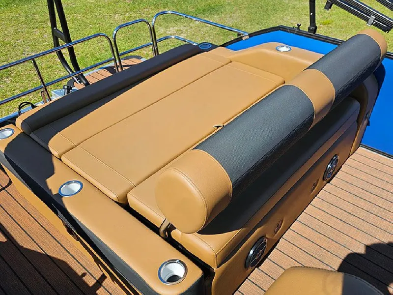 Slide: The Image of 2025 Bentley Pontoons 223 Elite Swingback Tritoon with luxurious tan seating and cup holders. - 14