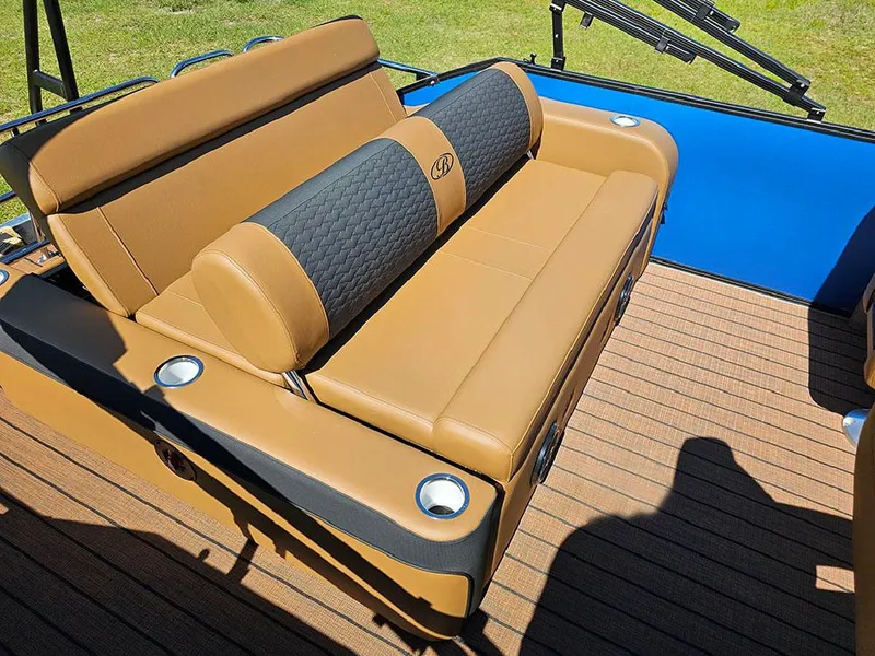 Slide: The Image of 2025 Bentley Pontoons 223 Elite Swingback Tritoon with tan seating and cup holders. - 18